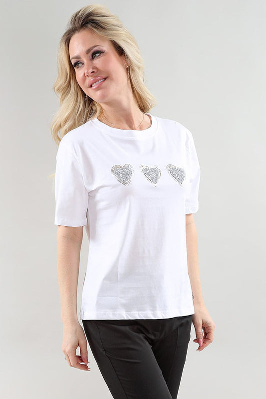 White women’s t-shirt with three heart embellishments across the chest and short sleeves